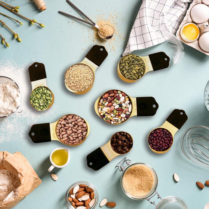 Magnetic Measuring Cup and Spoon Set, including 7 gold-colored stainless steel measuring cups and 8 magnetic gold measuring spoons with 1 leveler for cooking and baking