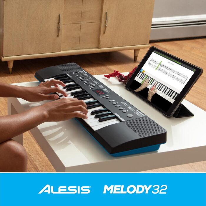 Alesis Melody 54 - Портативна клавіатура з 54 клавішами, вбудованими динаміками, 300 звуками, 300 ритмами, 40 демо-піснями, навчальними інструментами, мікрофоном та підставкою для нот (32 клавіші)