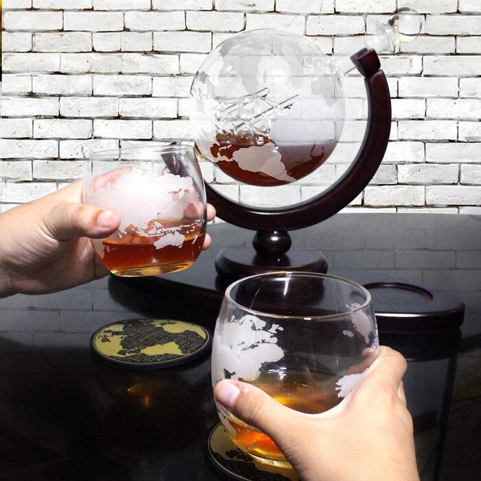 Globus Decanter Gift Set. Includes a wooden base, 2 glasses, 2 coasters, a shot glass, and a funnel. This whiskey decanter and glasses set is the perfect gift.