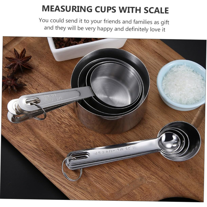 2 Measuring spoons, baking, kitchen machine, cookware, kitchenware, cookrings, saucer, kitchen scales, measuring cup, measuring spoons (scaled, graduated), stainless steel, silver.