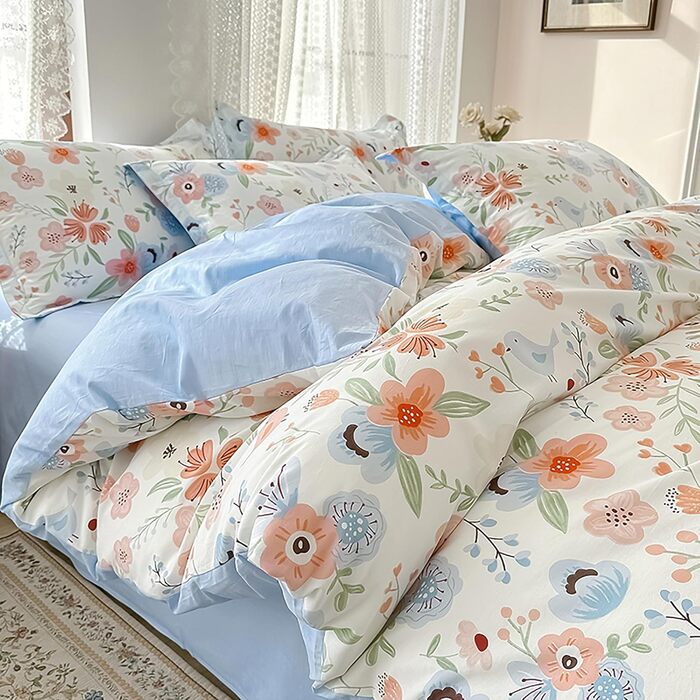 Блискуча постільна білизна Bunt Blumen з бавовни 100x135 см. Комплект для дитячого ліжка: простирадло, ковдра та подушка з квітковим малюнком.