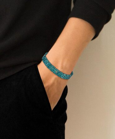 Браслет Lacoste MetroPole з застібкою-кнебелем. Зелений, з візерунком petit piqué. Для чоловіків та жінок