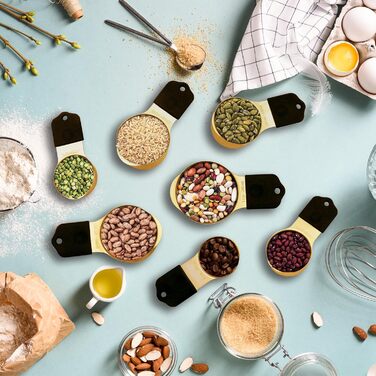 Magnetic Measuring Cup and Spoon Set, including 7 gold-colored stainless steel measuring cups and 8 magnetic gold measuring spoons with 1 leveler for cooking and baking