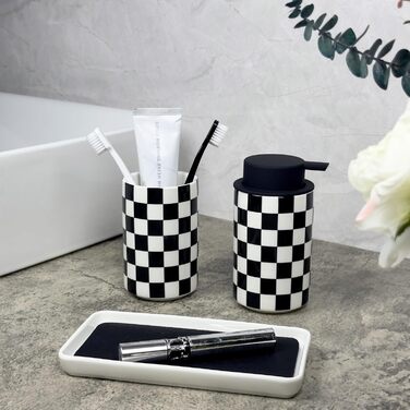 Modern bathroom set, ceramic, glazed, black and white checkered accessory set with soap dispenser, toothbrush holder, and vanity organizer.